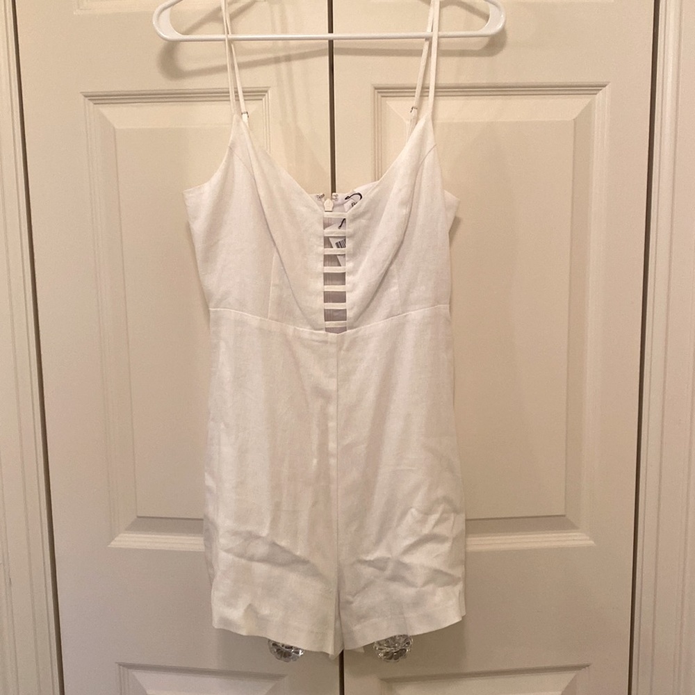 Super cute white romper. Great for a honeymoon, bachelorette party, or vacay!